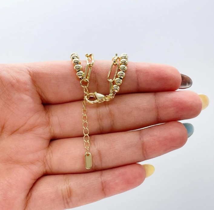 Pulsera doble chapada en oro de 18 quilates con eslabones de clip y cuentas de turquesa.