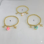 (MBRA-10-J) Pulsera de acero inoxidable con dijes y cuentas.