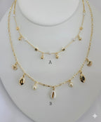 (1-6100) Collar con dijes de perlas y laminado dorado - BGF