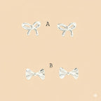 (2-3076) 925 Sterling Silver - Bow Stud Earrings.